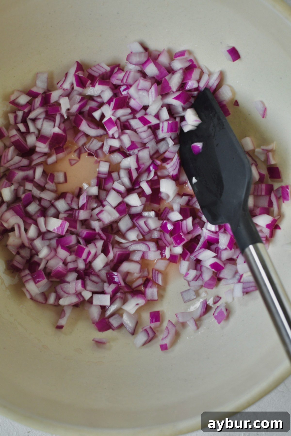 Creamy Ranch Potato Salad 5 Onions soaking in rosé vinegar for a quick pickle to take the raw bite off of them.