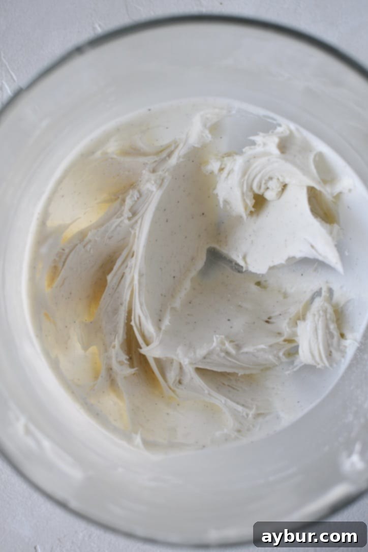 Butter and Cream Cheese creamed till fluffy in a stand mixer bowl. Powdered Sugar and Vanilla added.