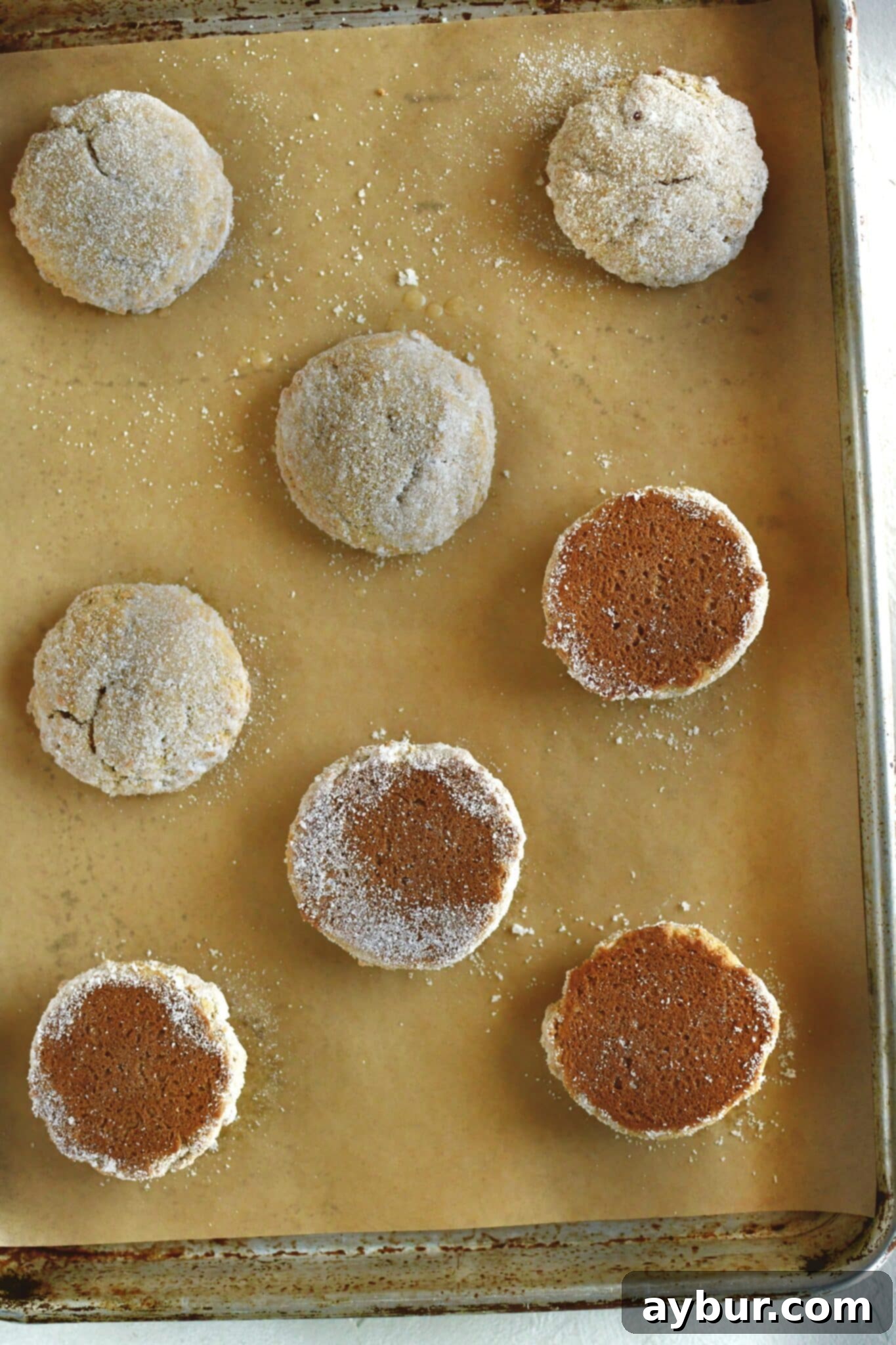 Whoopie pies ready to be filled with the cream, half turned over to be piped on.