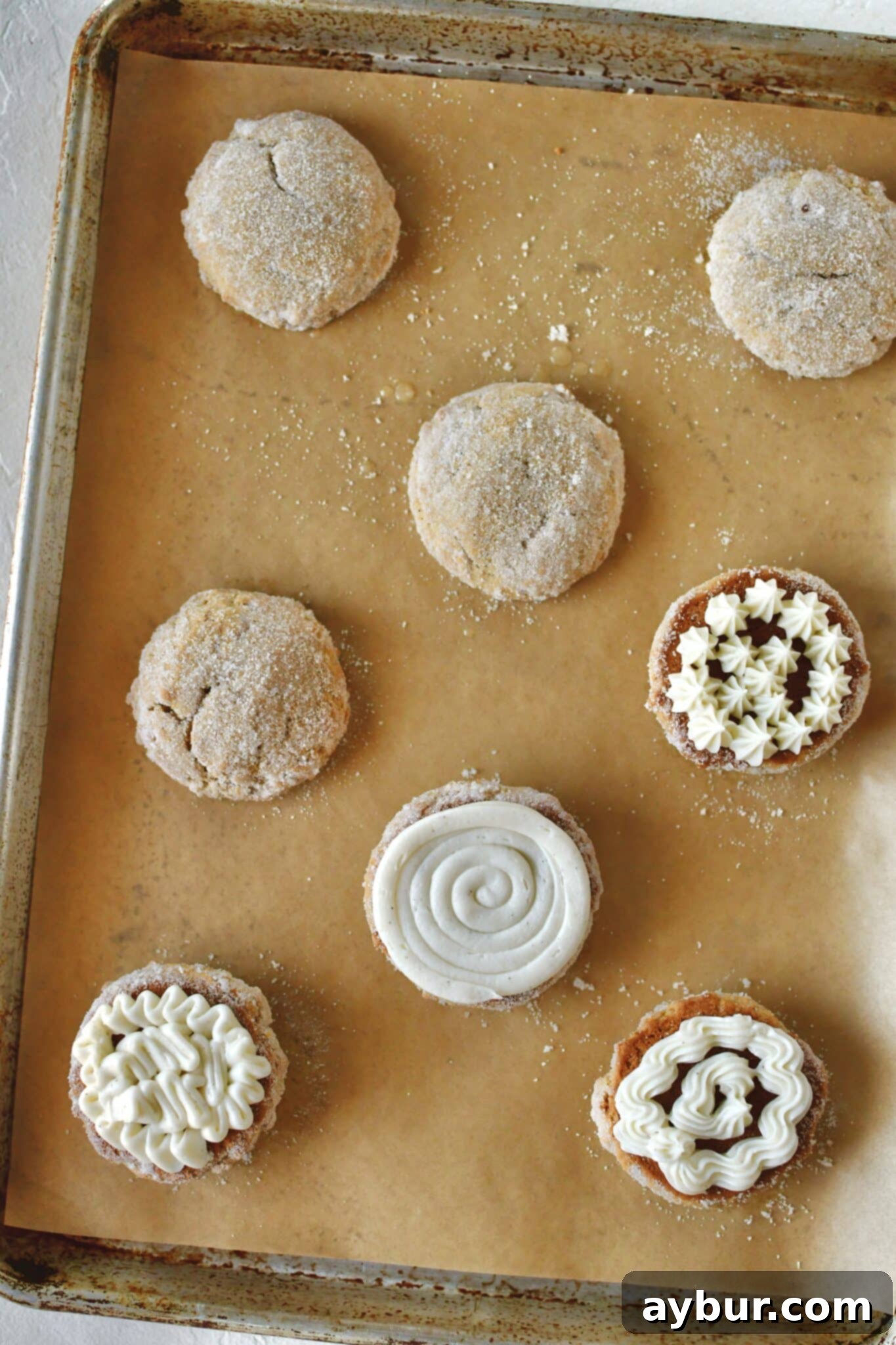 Whoopie pies that have been filled with the cream on one side.