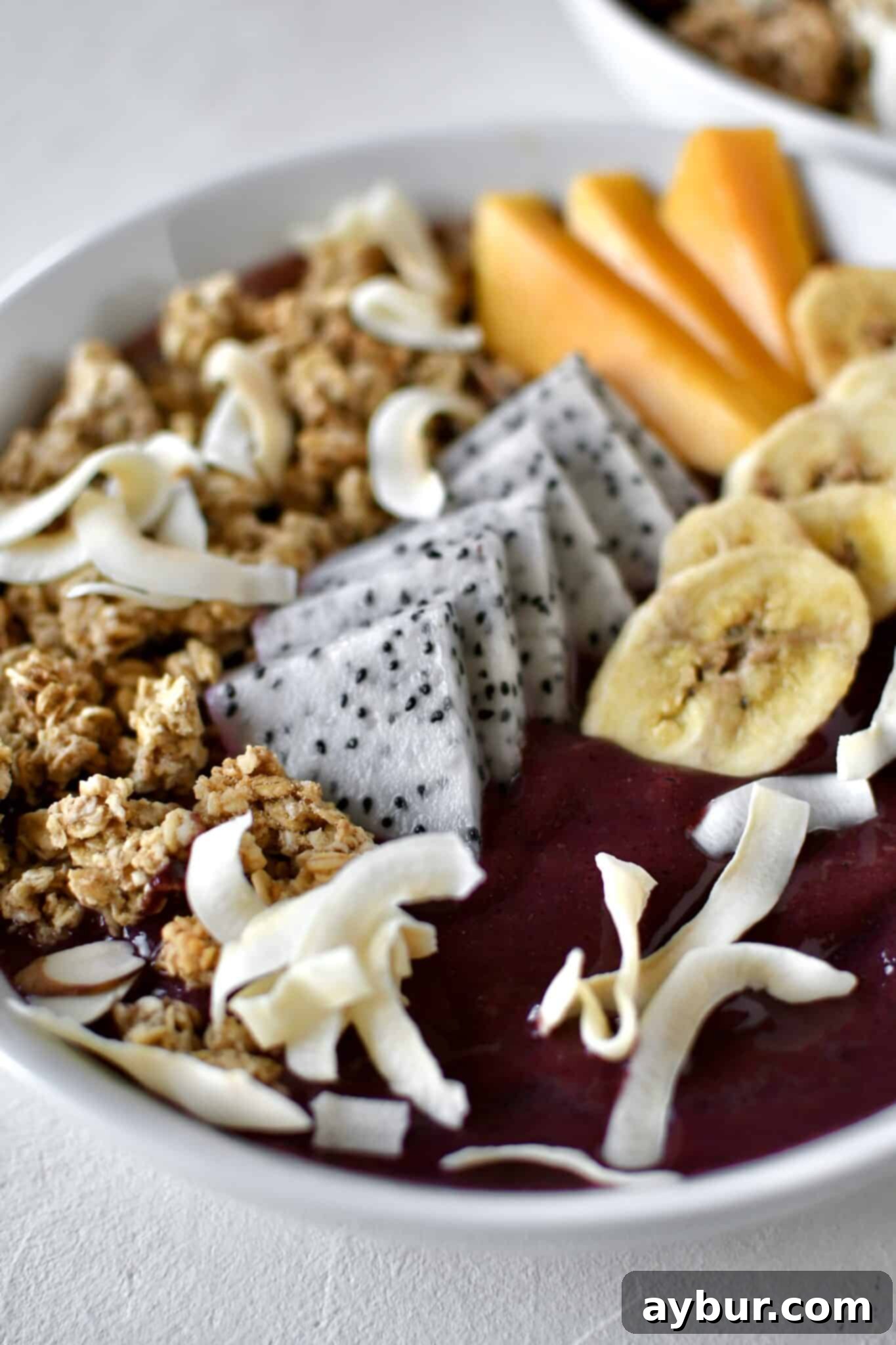 Smoothie Bowl, topped with fresh and dried fruit, ready to eat.