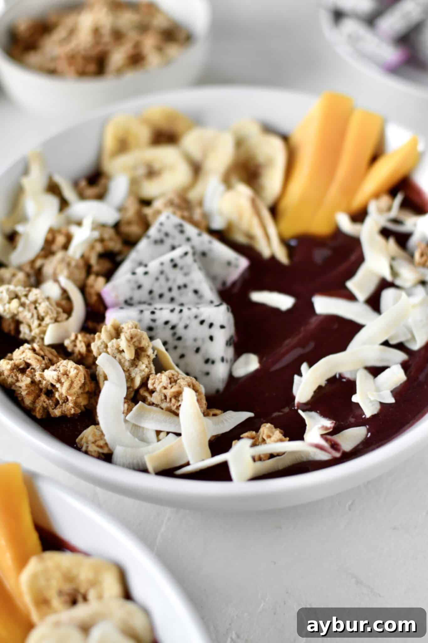 Smoothie Bowl, topped with fresh and dried fruit, ready to eat.
