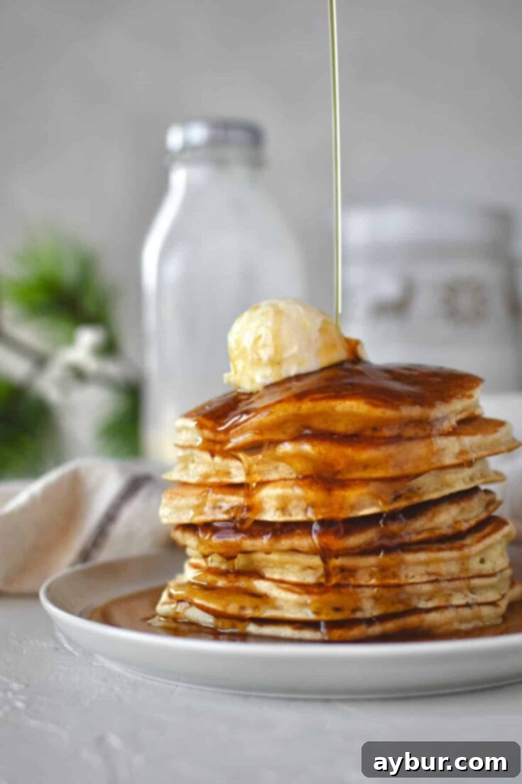 A final shot of Eggnog Pancakes, enticing and ready to be devoured, with festive decor.