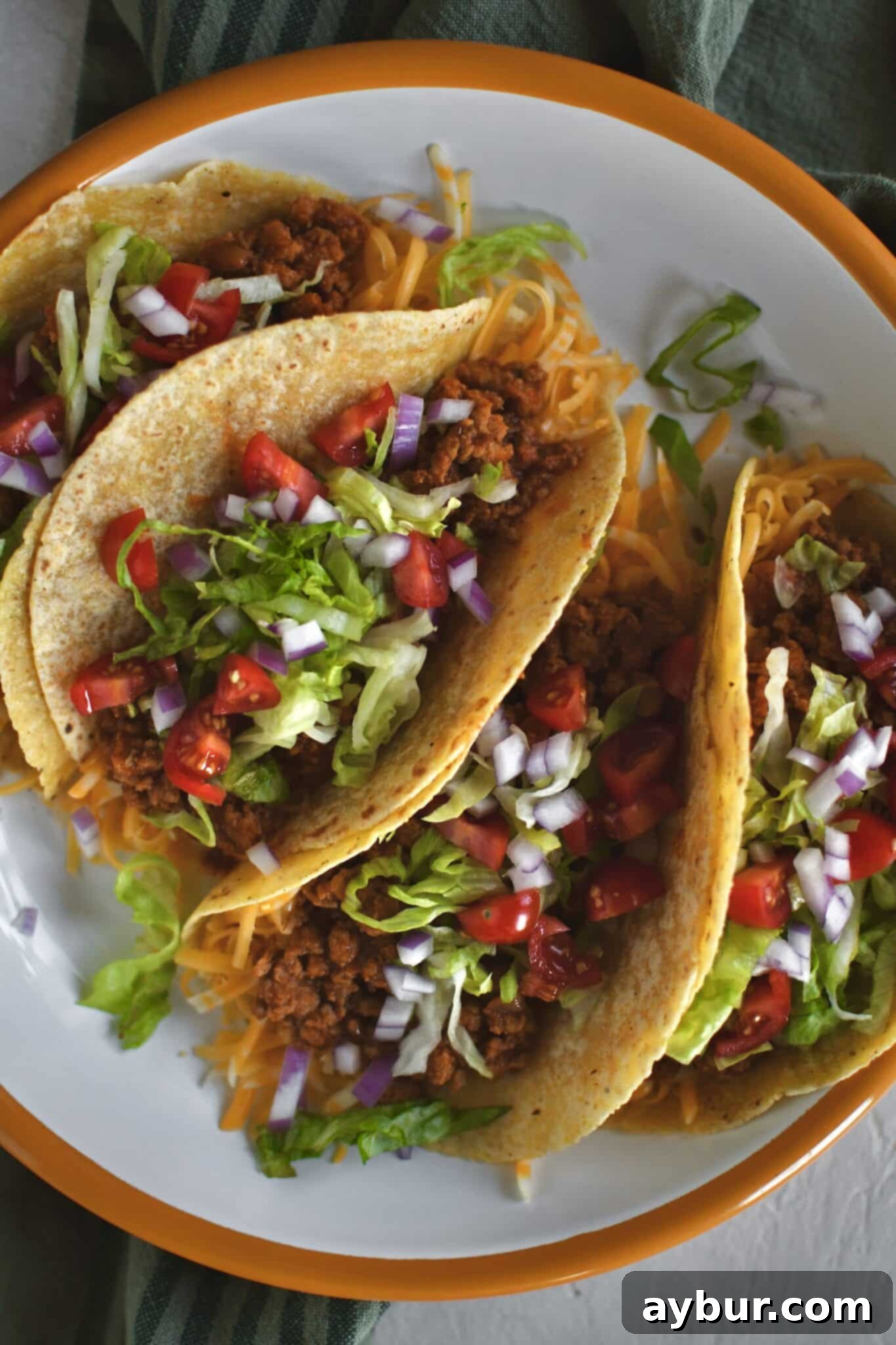 Flavorful Ground Turkey Tacos ready to be served on a platter, piled high with fresh toppings.