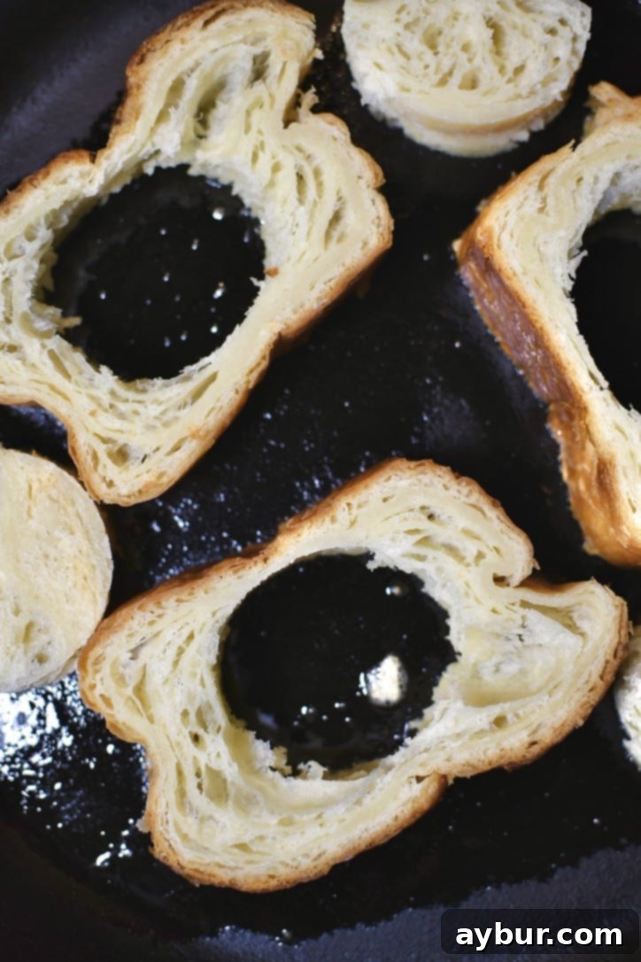Bread and the centers place in a warm pan to toast the buttered side.