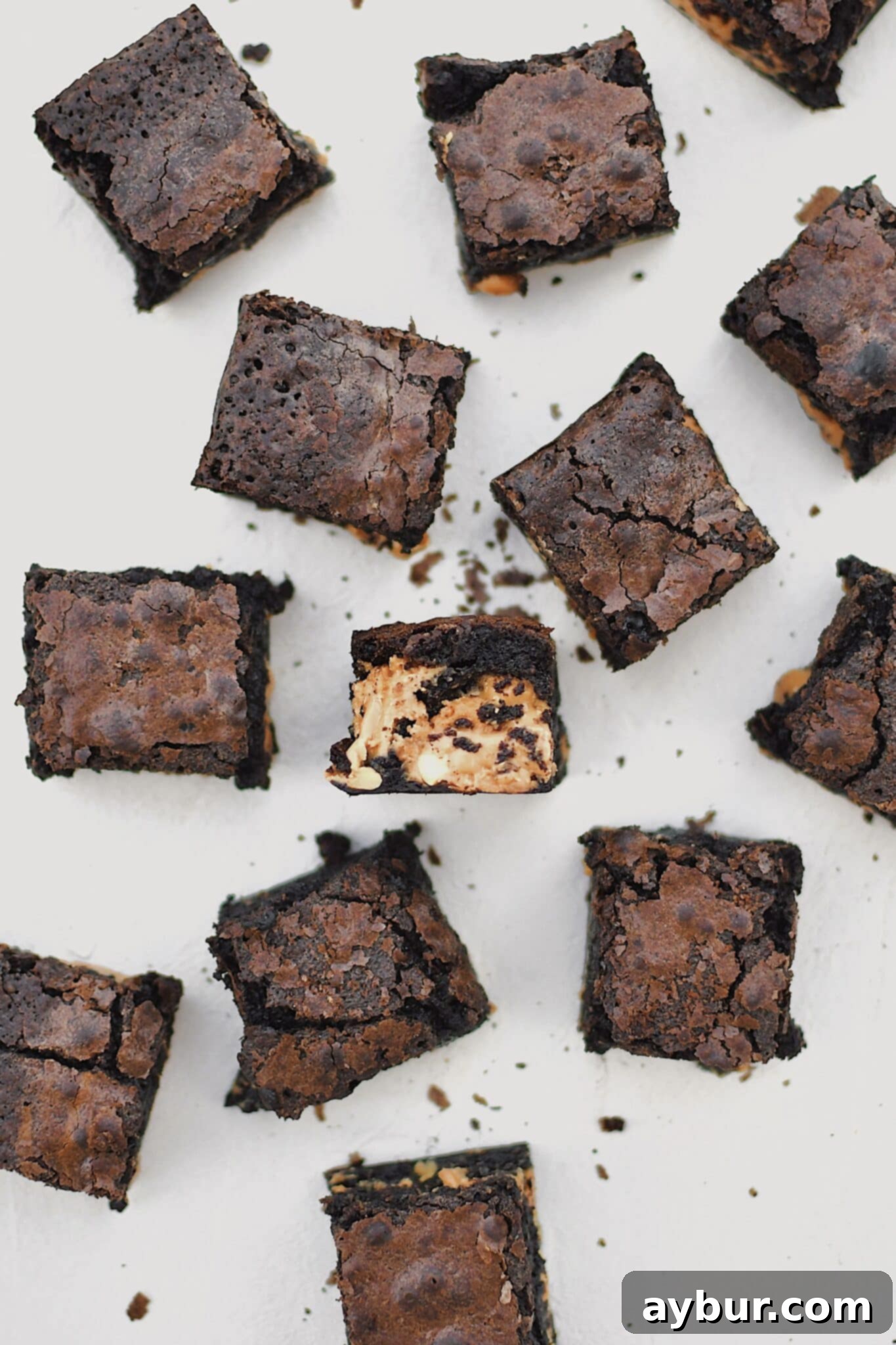Peanut Butter Brownies scattered on a platter, cut and ready to eat.