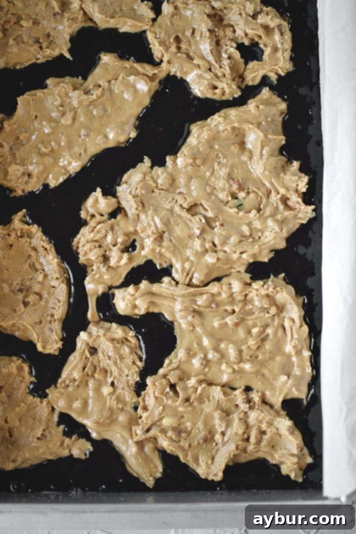 Topping half the brownie batter with the peanut butter filling.