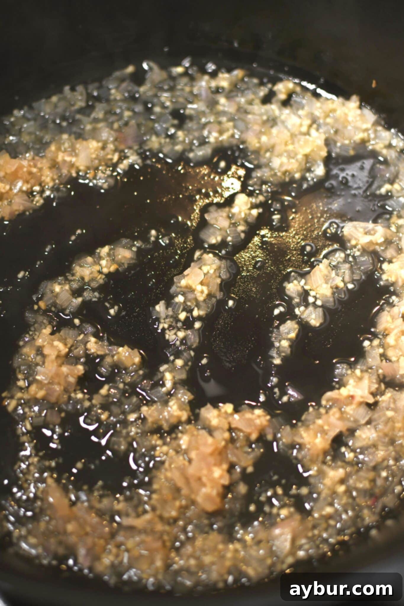 Wine, garlic, and shallots cooked down to "au sec" ready to add the cream.