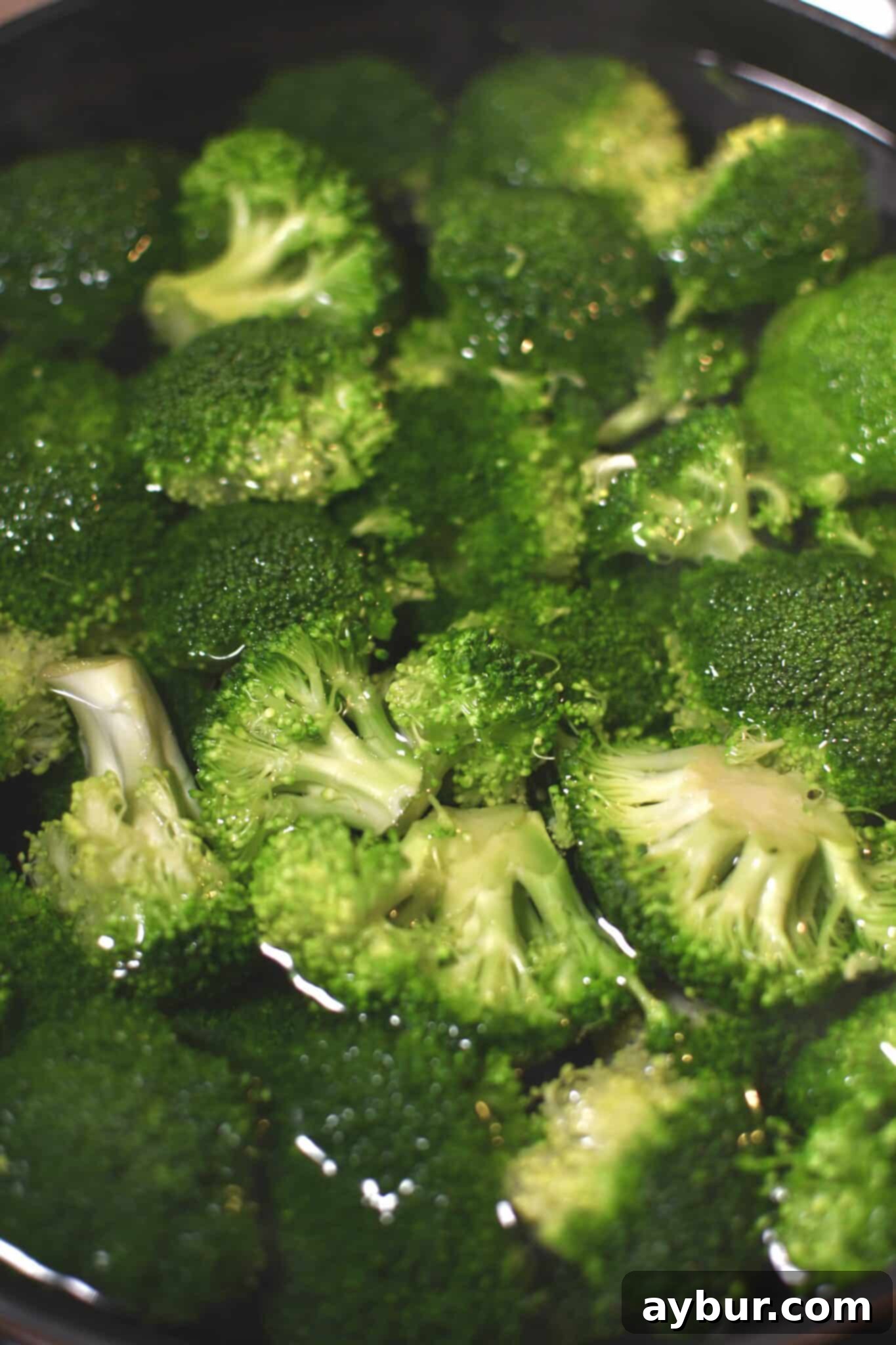 Broccoli added to boiling water to blanch for 1 minute.