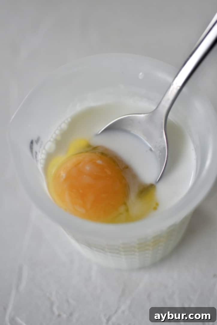 Step-by-step image of combining self-rising flour, baking powder, and baking soda for the biscuit dough.