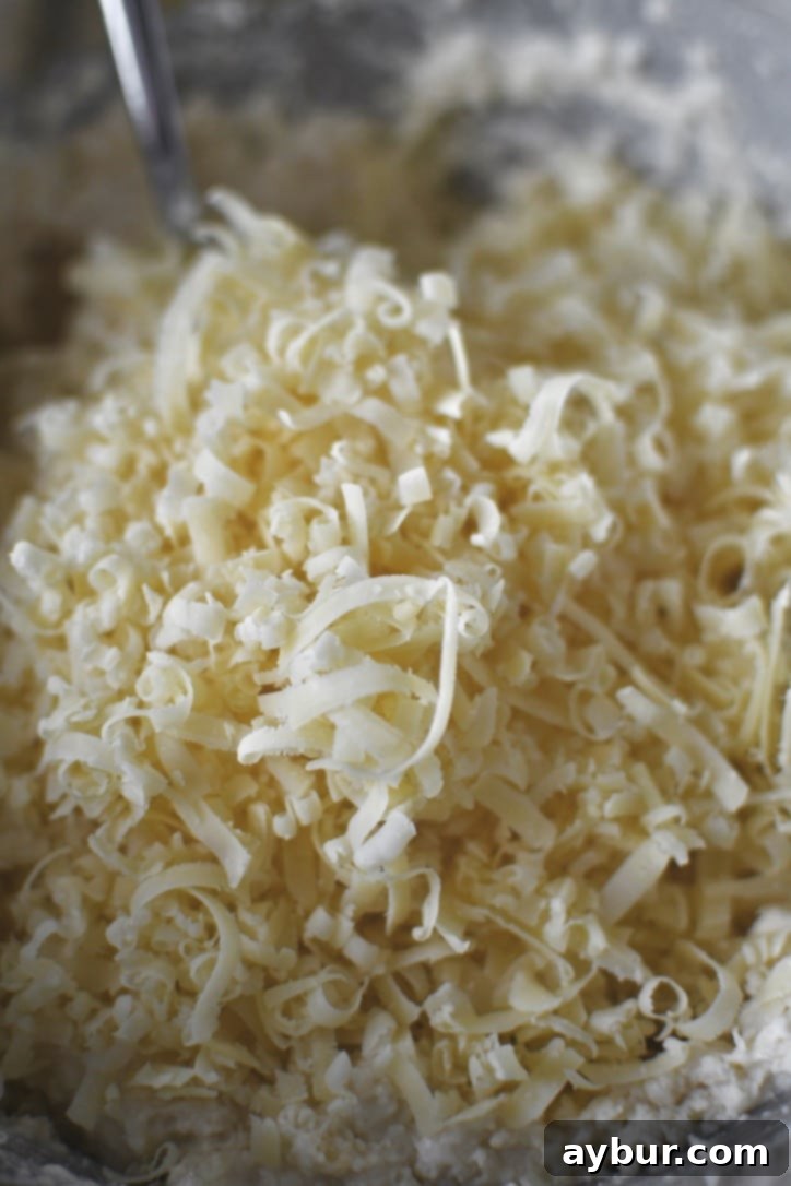 The finished biscuit dough with cheese folded in, ready to be covered and chilled.