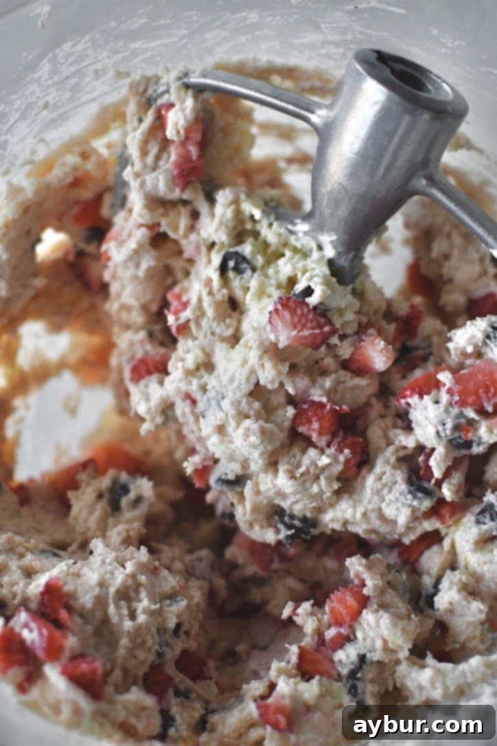 Strawberries and chocolate chips gently folded into the scone dough, maintaining their shape.