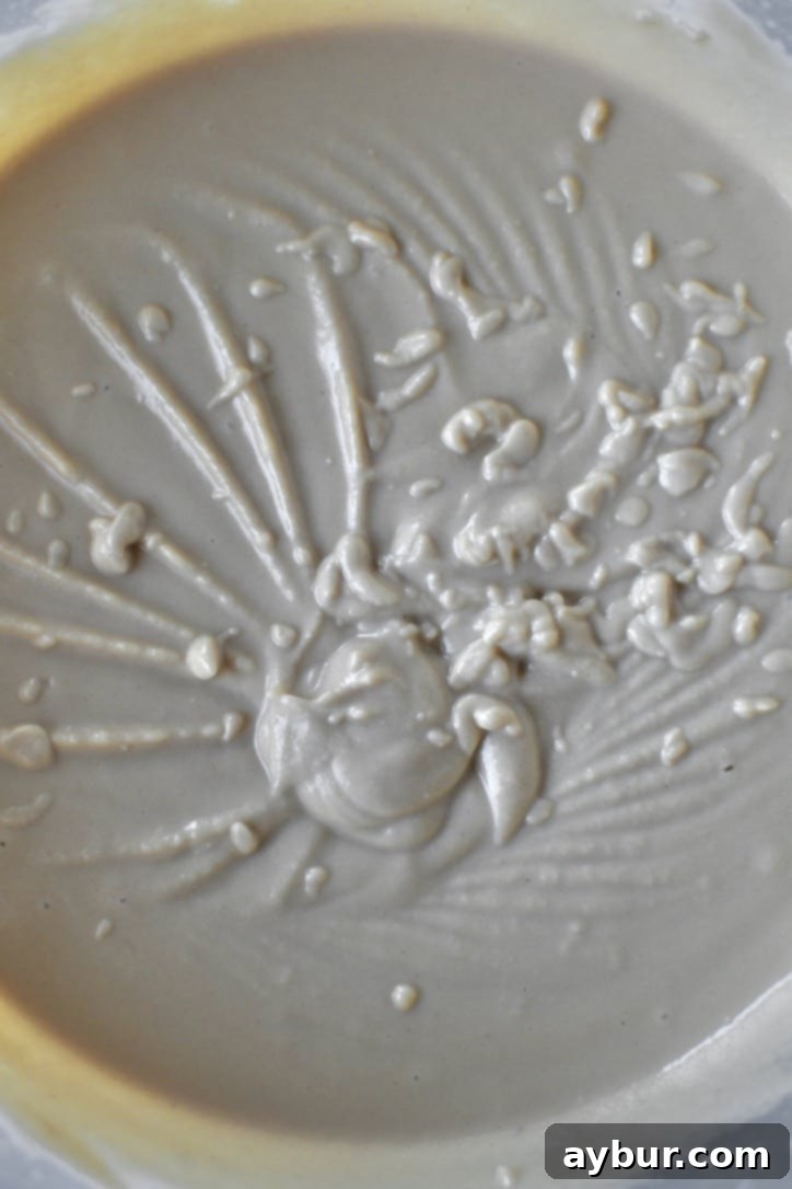 Creamy Homemade Hummus Perfection 8 Whipped Hummus in the bowl of a stand mixer.