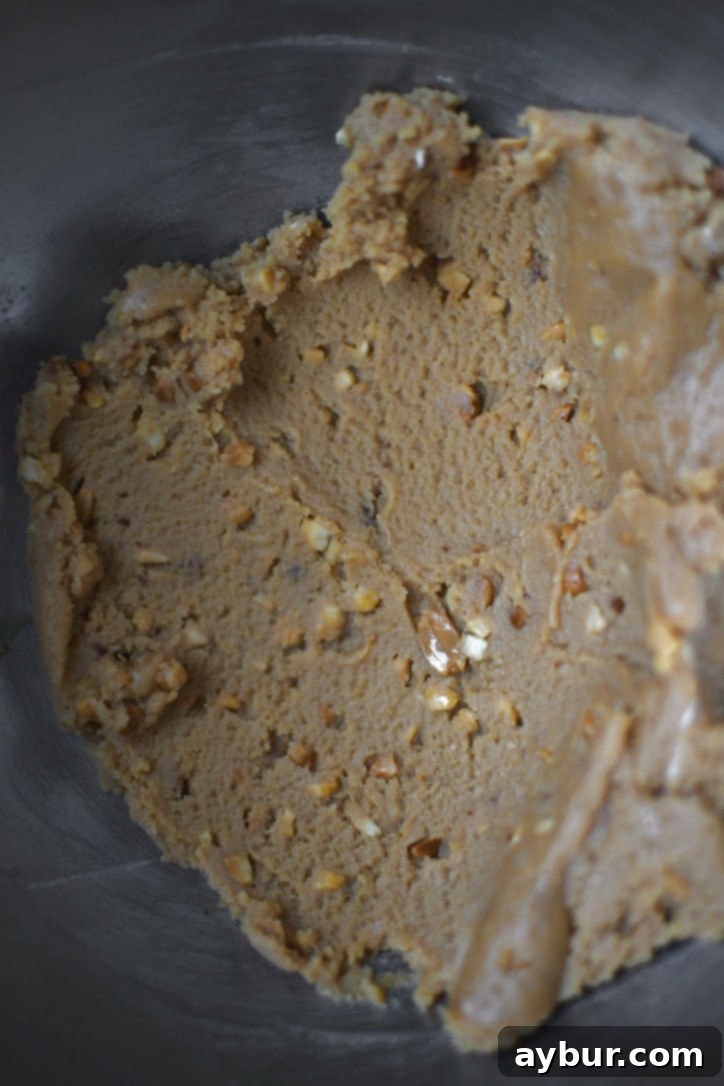Whipped cream cheese, peanut butter, and vanilla in a stand mixer bowl.