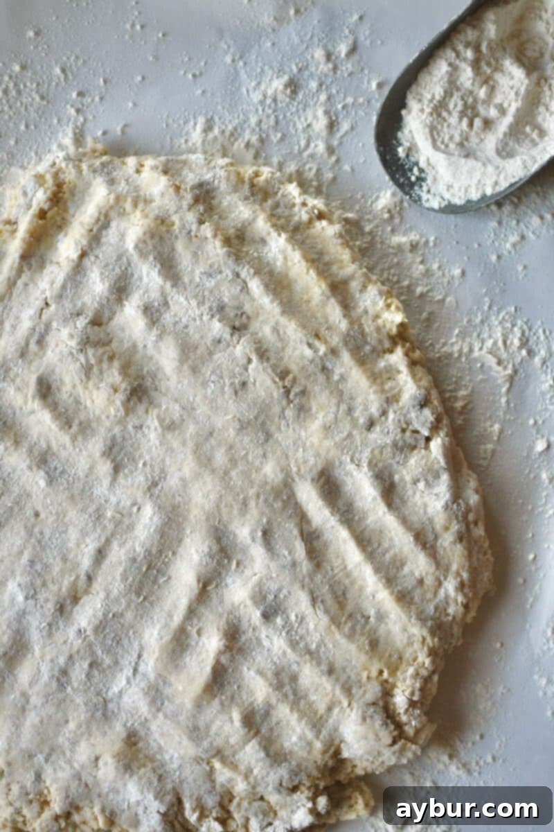 First pressing out of the biscuit dough.