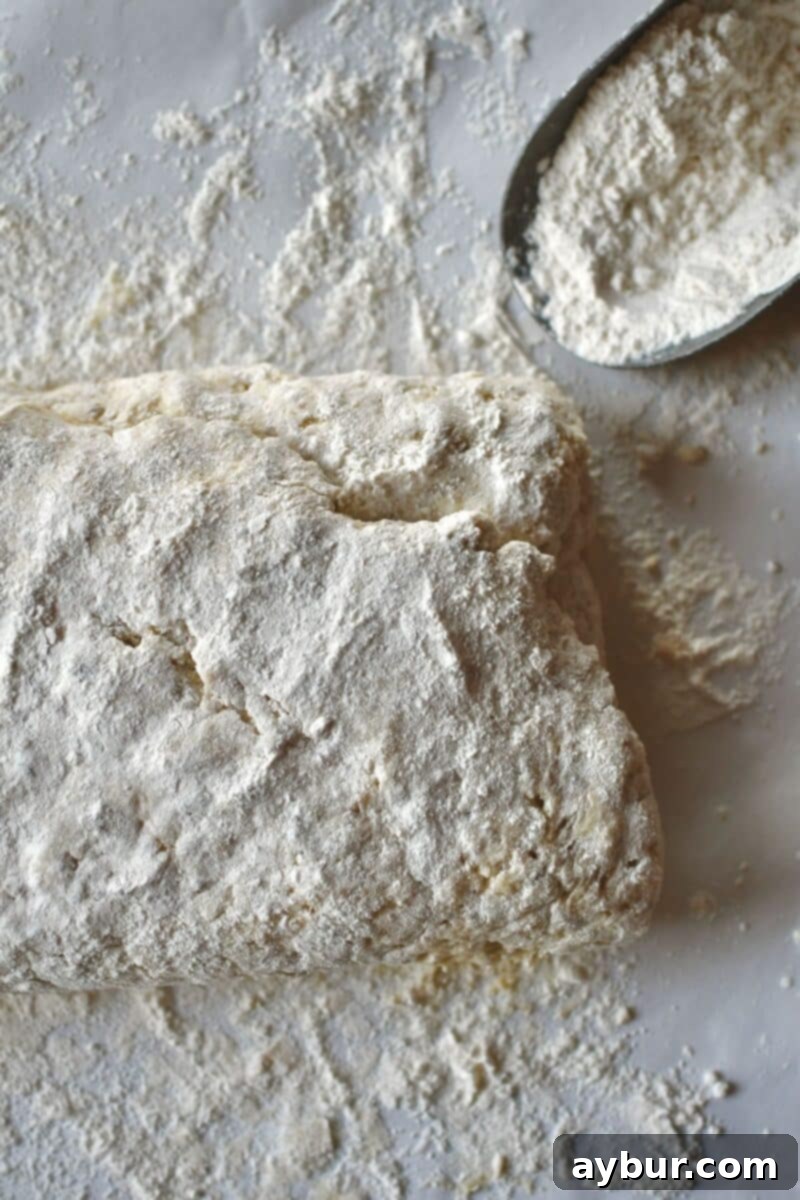 Letter folding the biscuit dough to create layers.