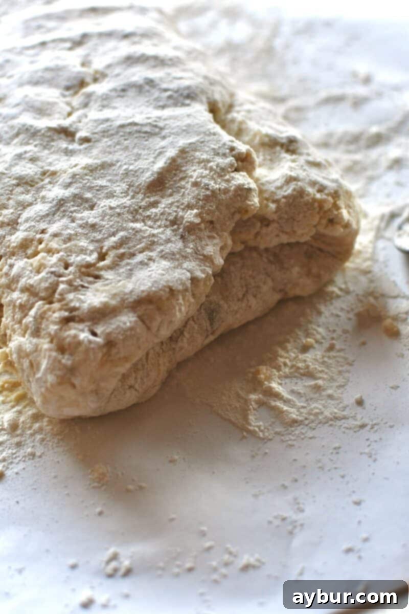Letter folding the biscuit dough to create layers.