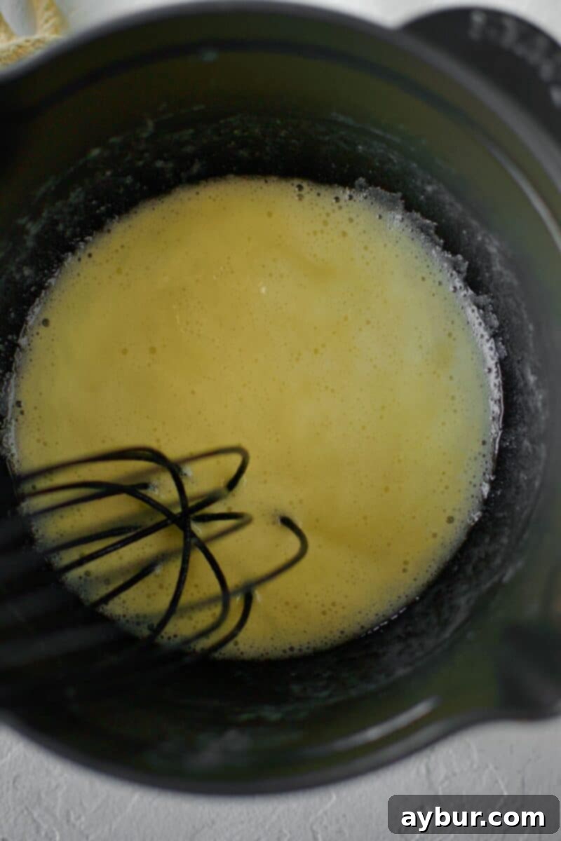 Creamy White Queso 4 Butter and flour are whisked together in a saucepan to form a light golden roux, the base for a creamy sauce.