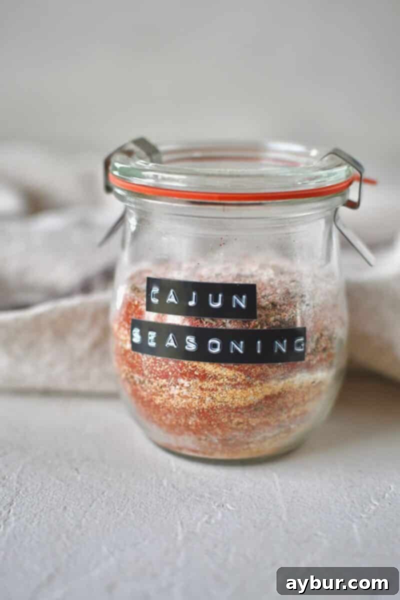Ingredients for cajun seasoning in a jar, before shaking to blend them.