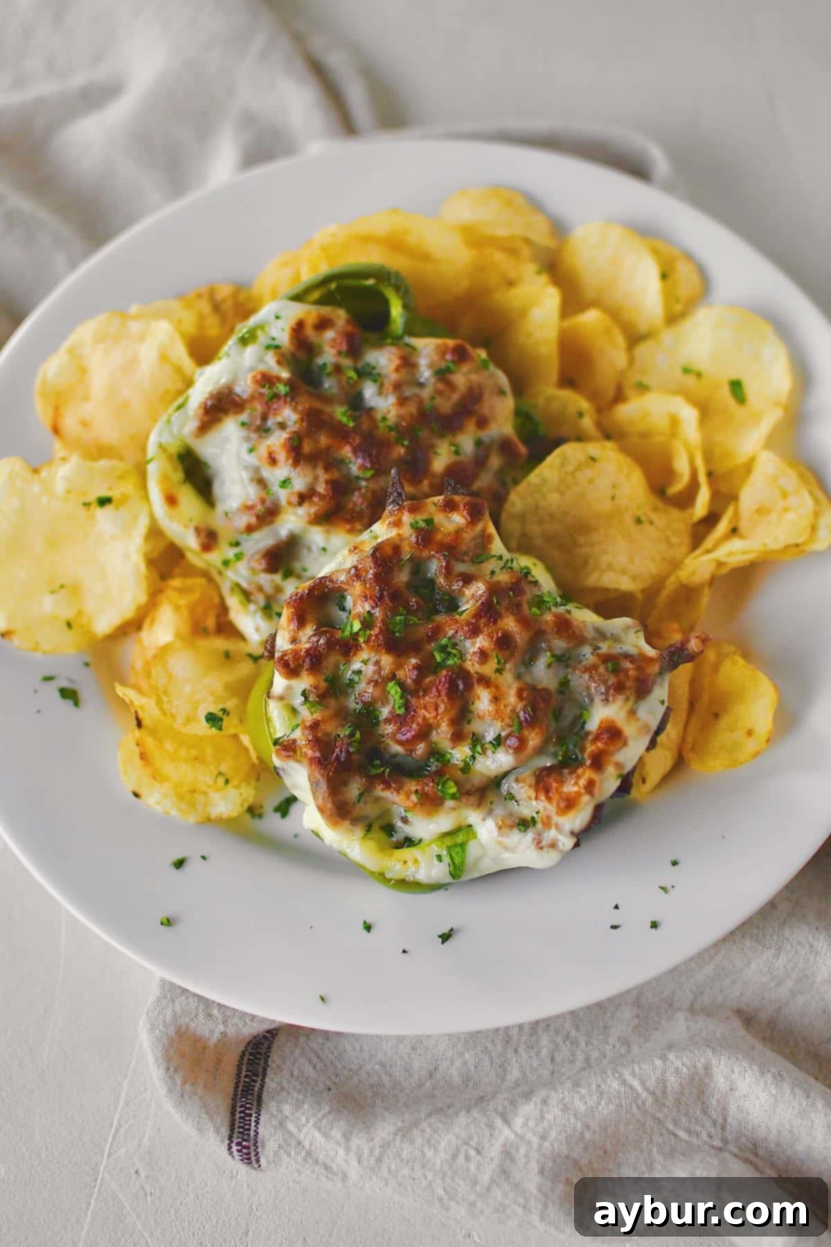A stunning close-up of a finished Philly Cheesesteak Stuffed Pepper, showcasing the melted cheese and flavorful filling, ready for a delicious meal.