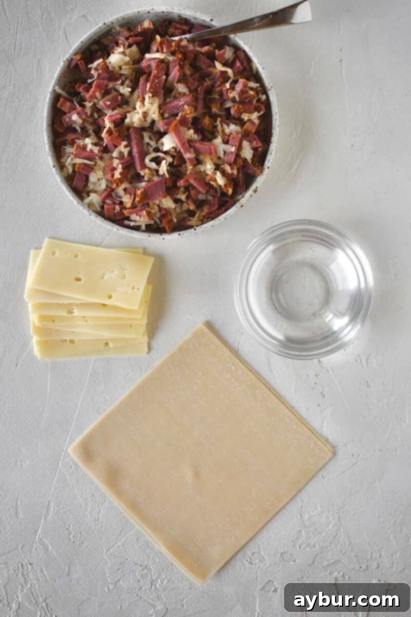 Getting ready to roll egg rolls, all ingredients laid out.
