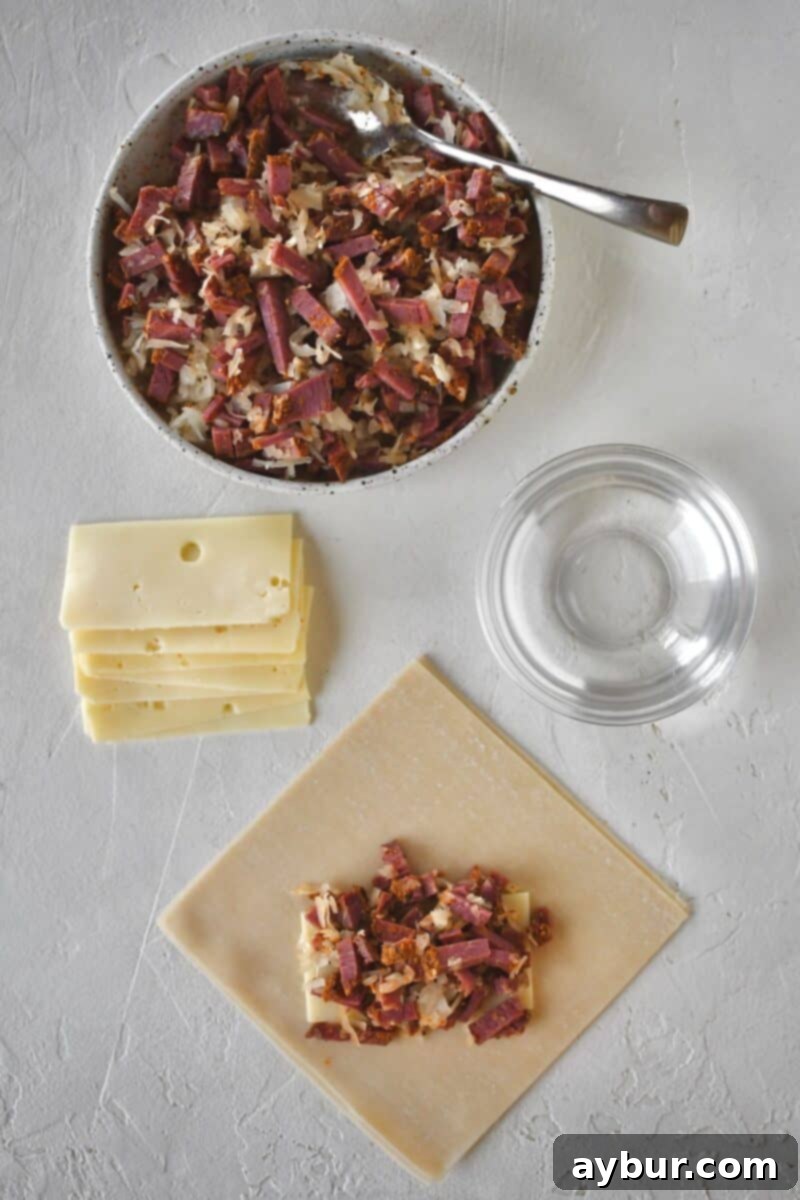 Adding the filling to an egg roll wrapper.