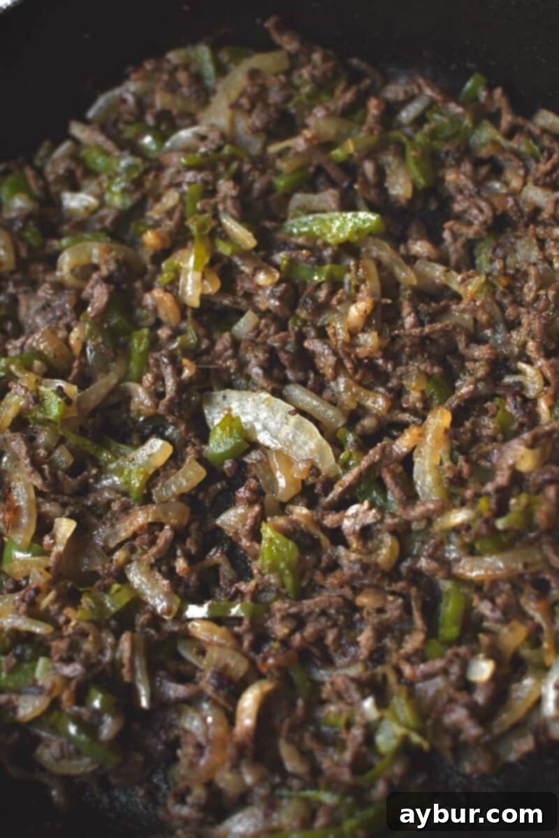 Fully cooked egg roll filling ready to cool and roll.