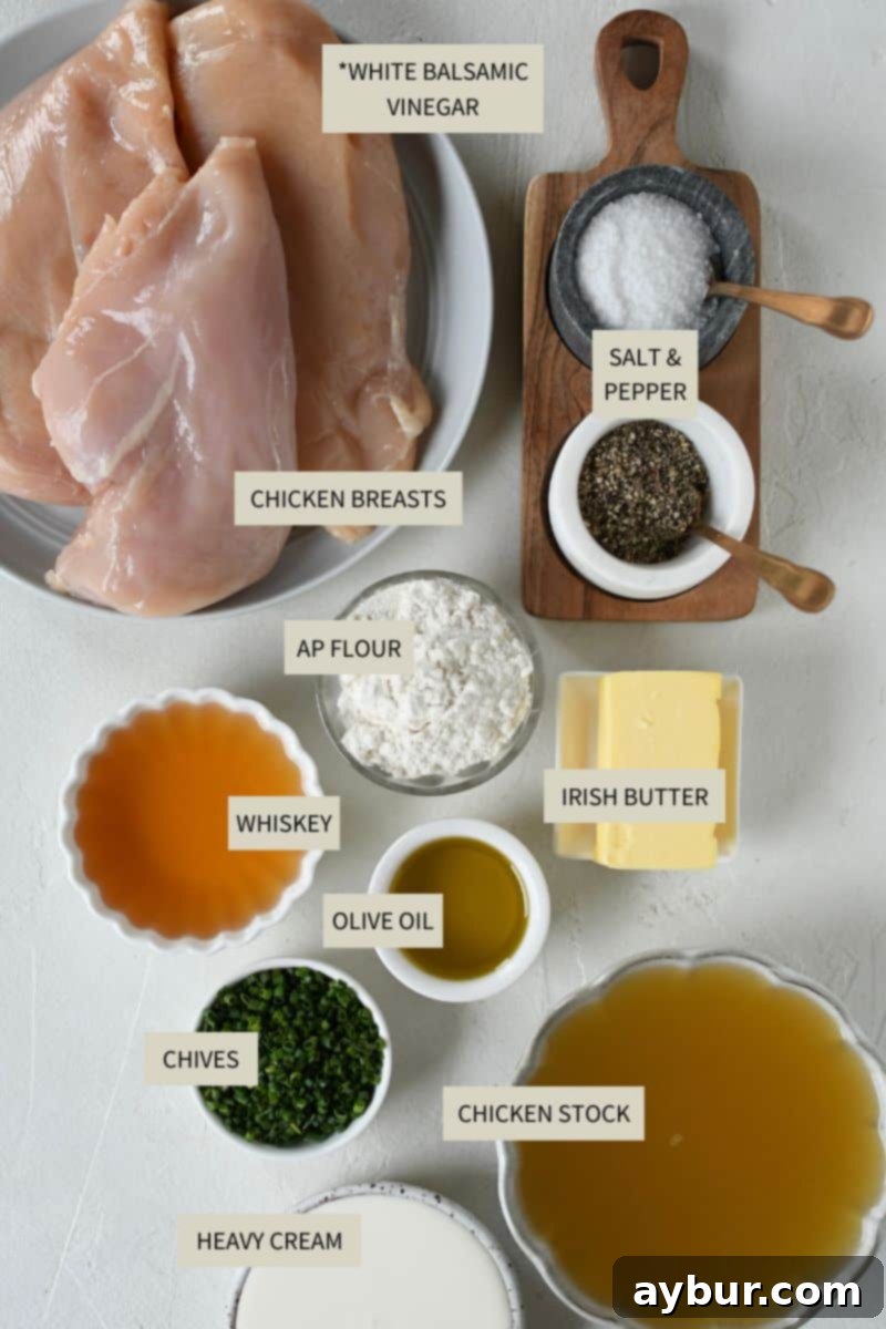 Creamy Irish Whiskey Chicken 3 Selection of fresh ingredients laid out, including chicken breasts, Irish butter, Irish whiskey, heavy cream, and herbs, ready for making Irish Chicken in Whiskey Cream Sauce.