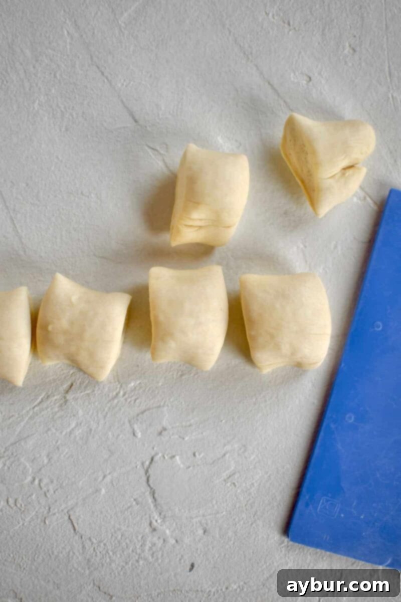 Proved dough rolled out and cut into pretzel bites.