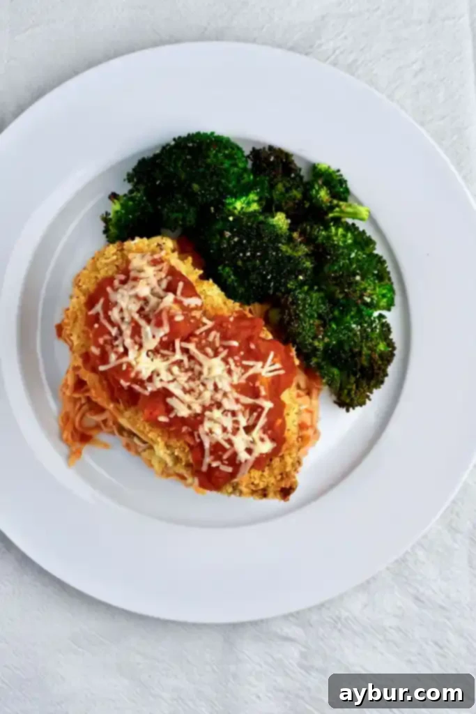 Crispy Chicken Parmesan 5 Finished Cleaned Up Chicken Parmesan served with pasta and broccoli
