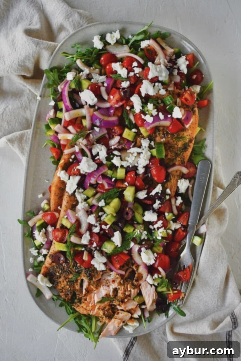 Zesty Greek Salmon 13 Greek Salmon topped with Greek salad topping of fresh veggies and feta cheese.