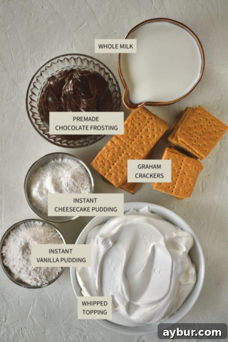 All the necessary ingredients laid out for making the Eclair Cake, including pudding mixes, milk, whipped topping, graham crackers, and chocolate frosting.
