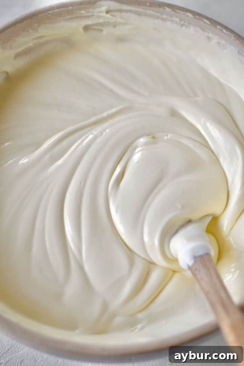 The pudding and whipped topping fully combined, creating a smooth and light custard filling.