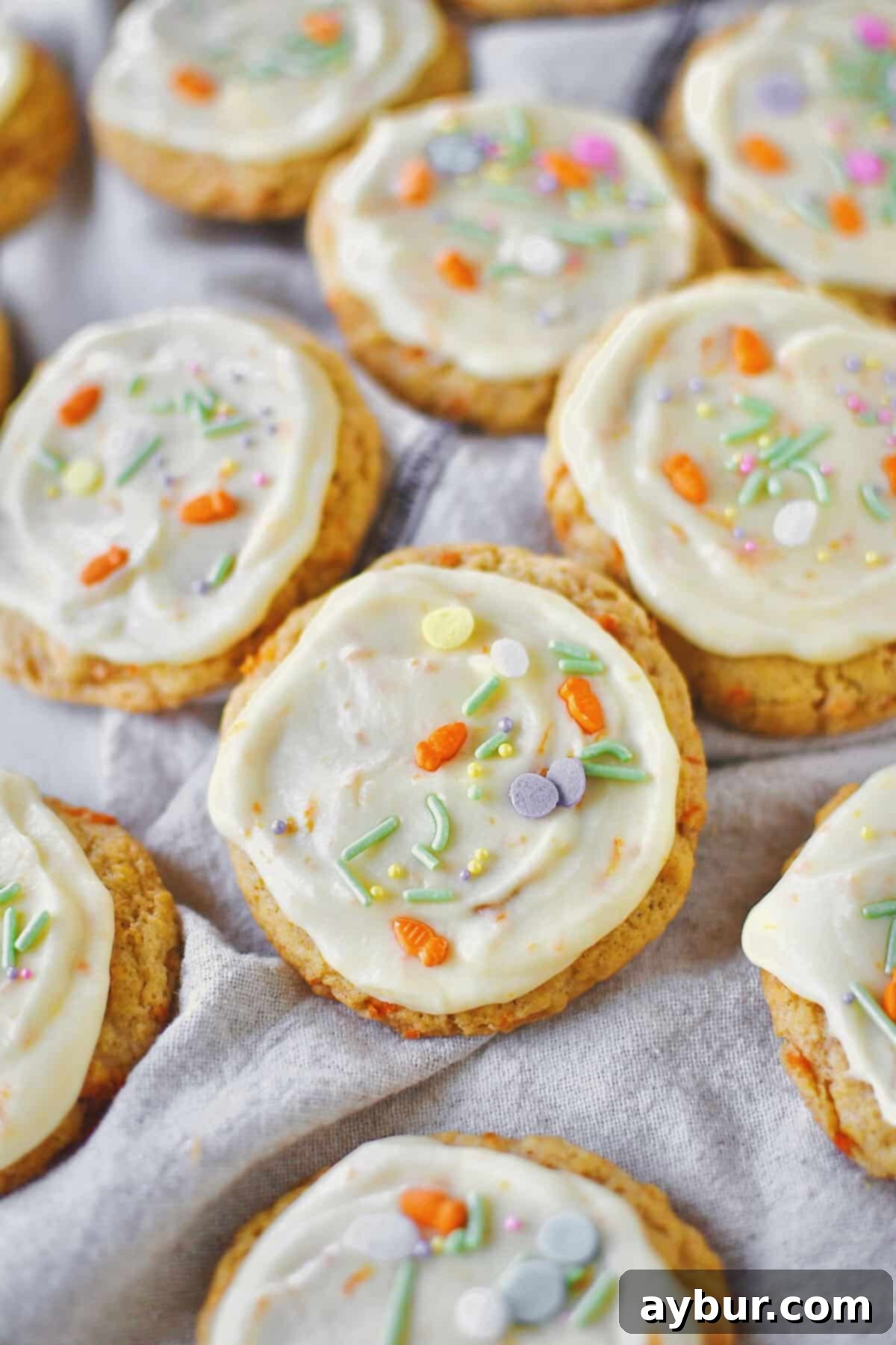 Spiced Carrot Cake Cookies 15 Carrot Cake Cookies laid out on a table. Festive Easter sprinkles add a colorful and celebratory touch to this batch of cookies.