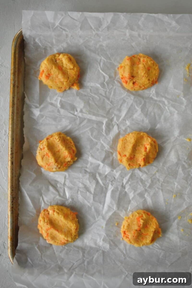 Spiced Carrot Cake Cookies 8 Portioning out the cookies on a parchment lined sheet pan, ensuring ample space between each dough ball for spreading.