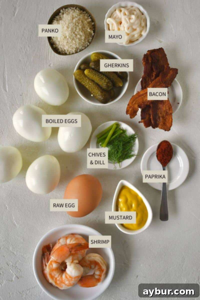An organized display of fresh ingredients laid out on a kitchen counter, featuring hard-boiled eggs, all-purpose flour, a raw beaten egg, panko bread crumbs, mayonnaise, yellow mustard, salt, pepper, and paprika, all essential for preparing Deep-Fried Deviled Eggs.