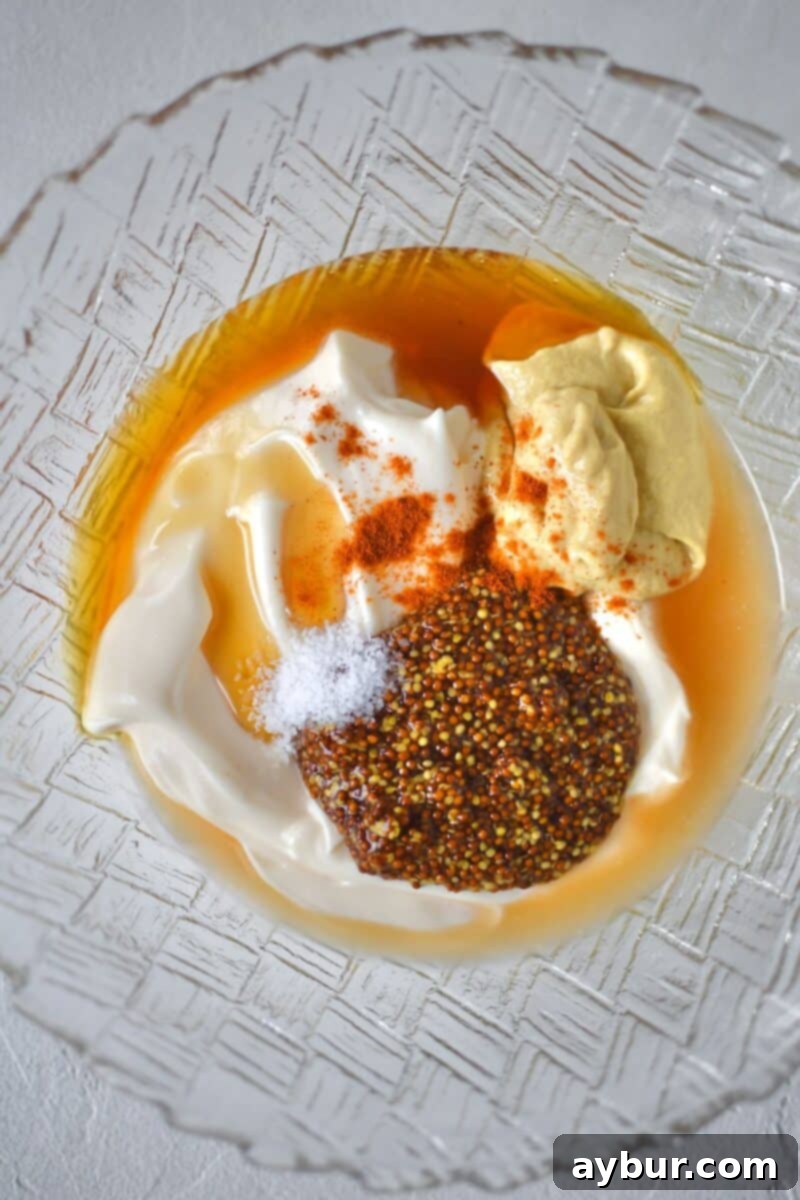 Zesty Honey Mustard Dressing 4 All ingredients for the honey mustard dressing added to a bowl, before mixing.