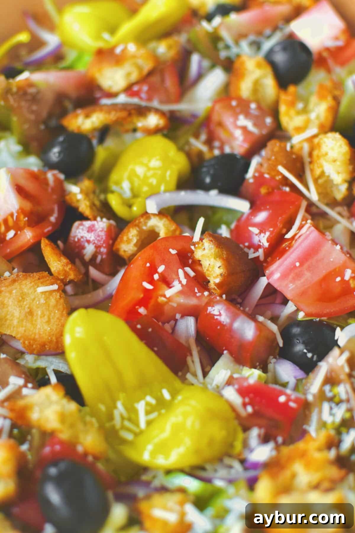 Prepared Olive Garden style Italian salad before tossing with dressing, showcasing fresh ingredients.
