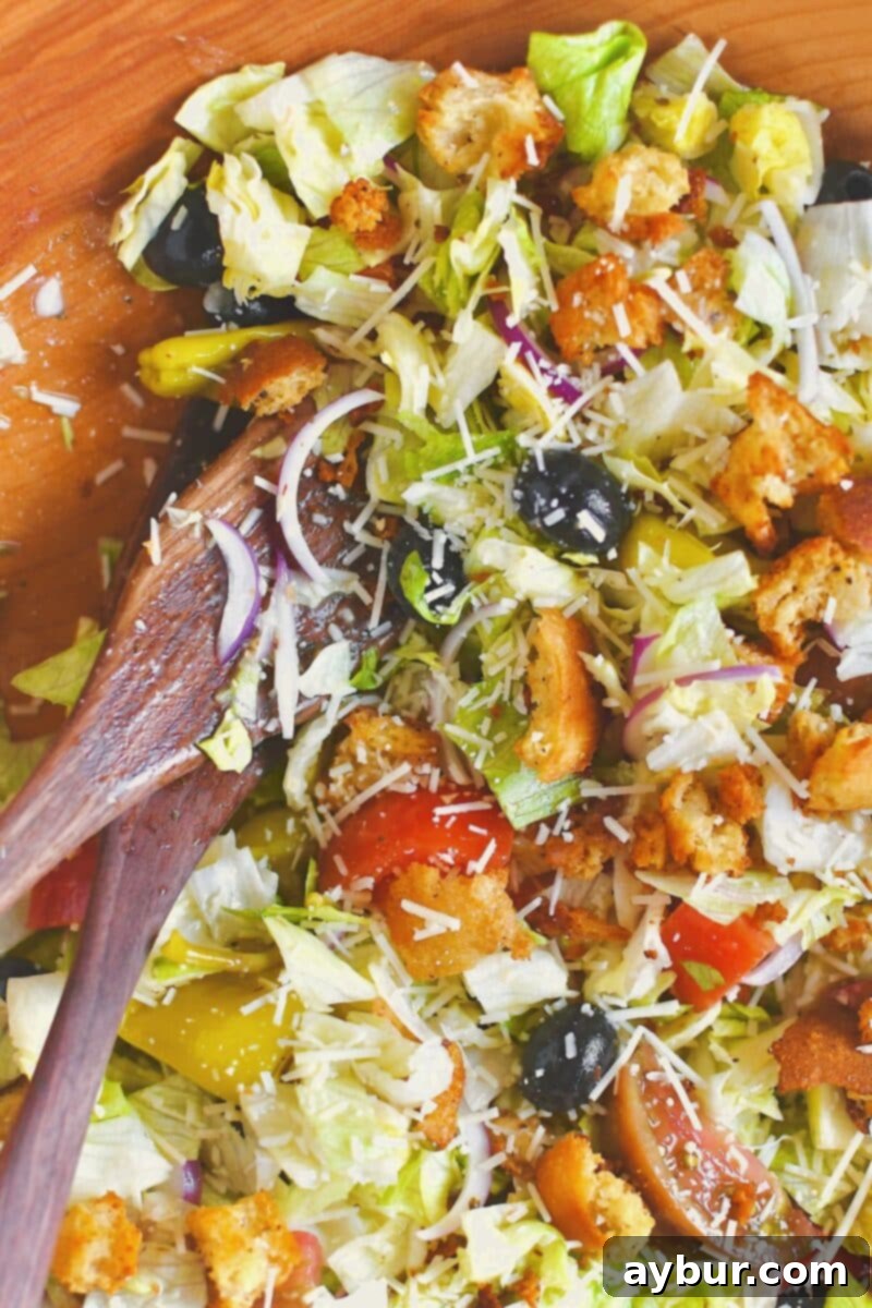 The prepared Olive Garden Italian Salad after a gentle toss, perfectly mixed and ready to serve.