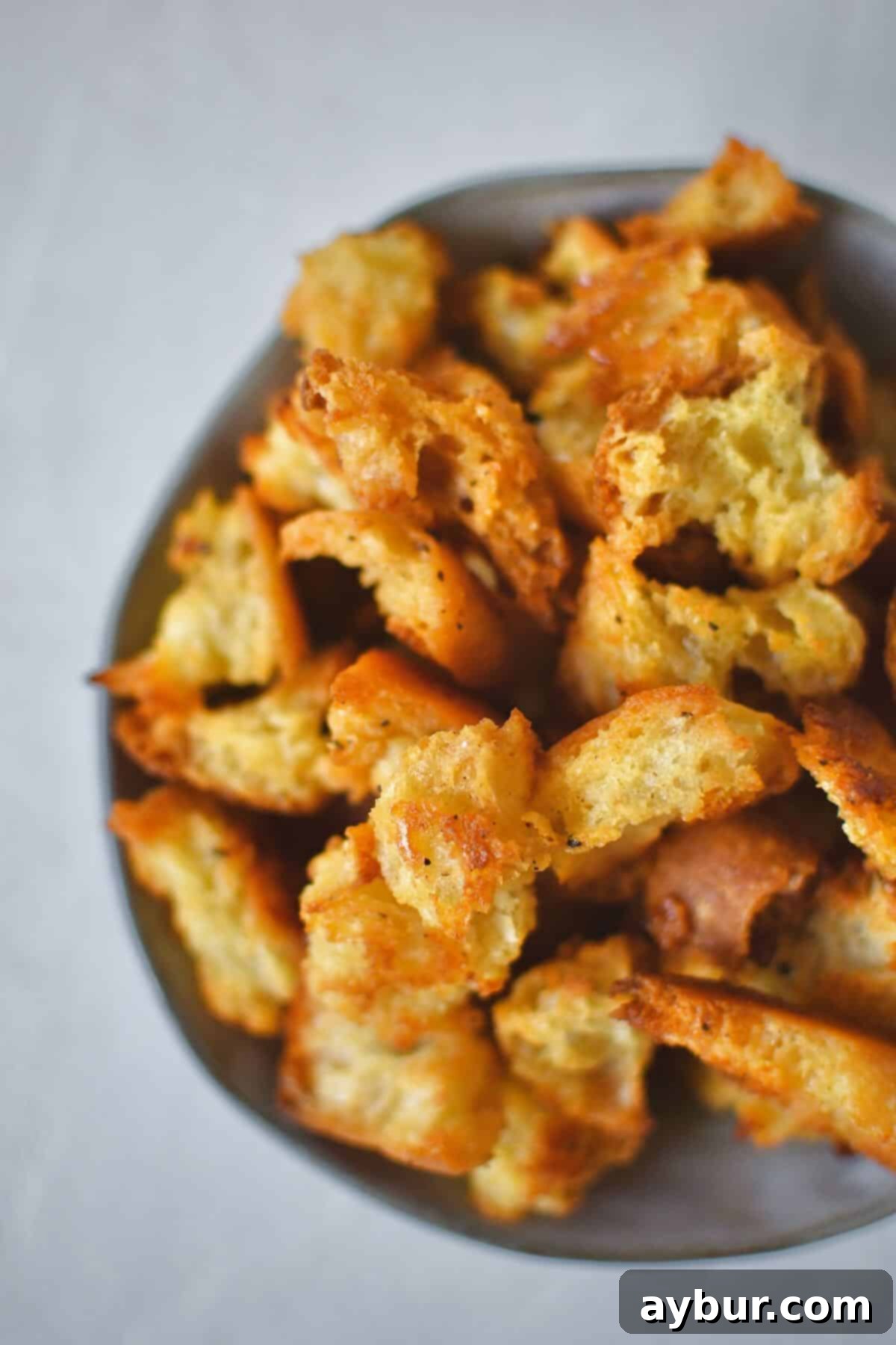 Homemade Croutons in a bowl ready to be used in a fresh salad.