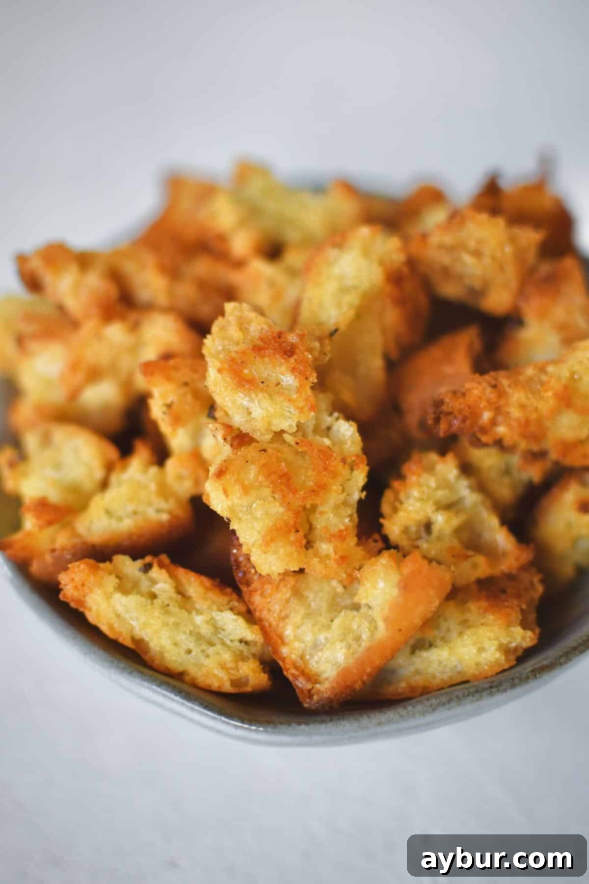 Homemade Croutons in a bowl ready to be used in a fresh salad.