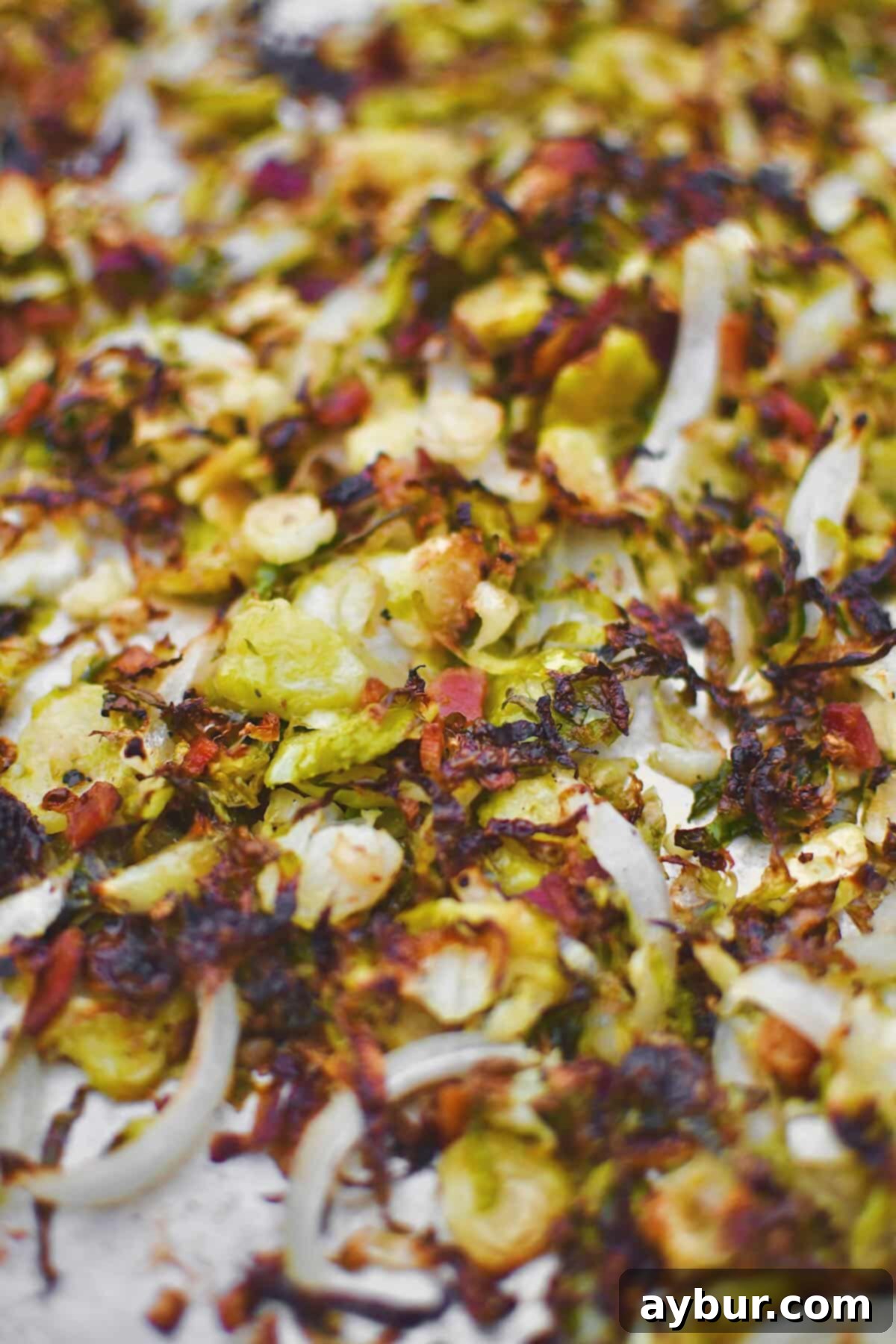 Crispy Bacon Brussels Sprouts after roasting, perfectly charred and ready to be served as a delicious side dish.