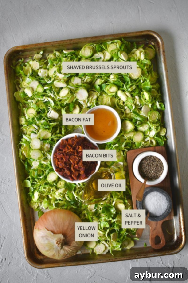 Ingredients needed to make Bacon Brussels Sprouts, including shaved sprouts, bacon, onion, oil, and seasonings.