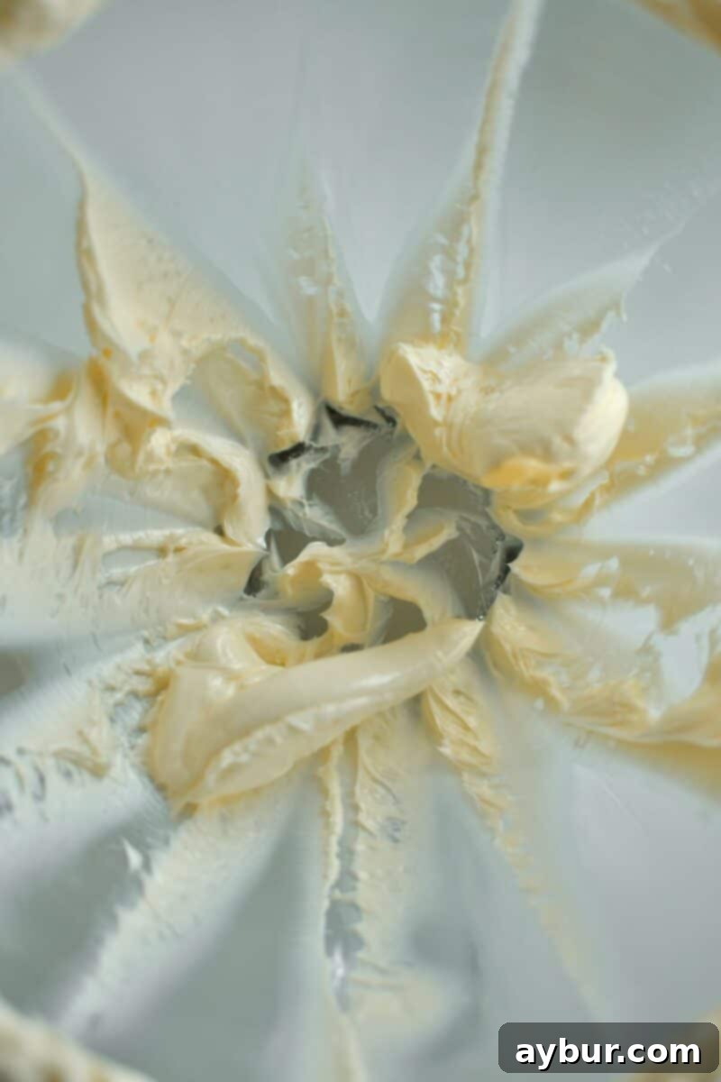 Stage 1 of making the cake, beating the butter till fluffy.