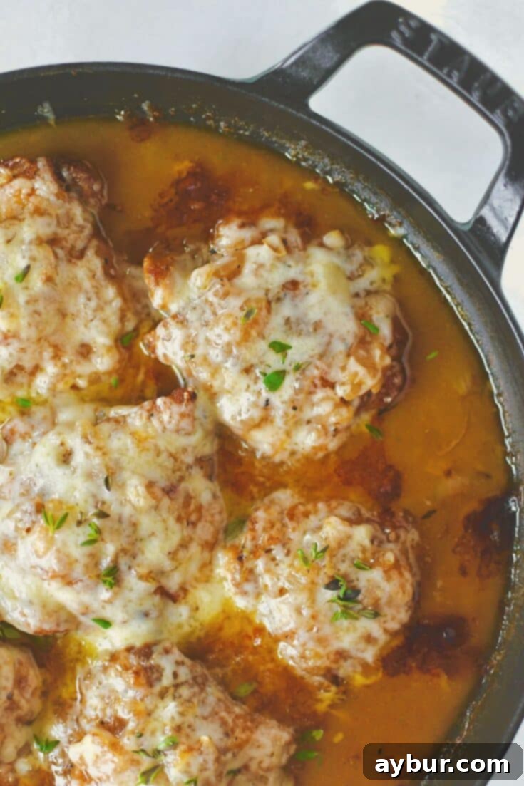 French Onion Chicken ready to eat covered in melty cheese.