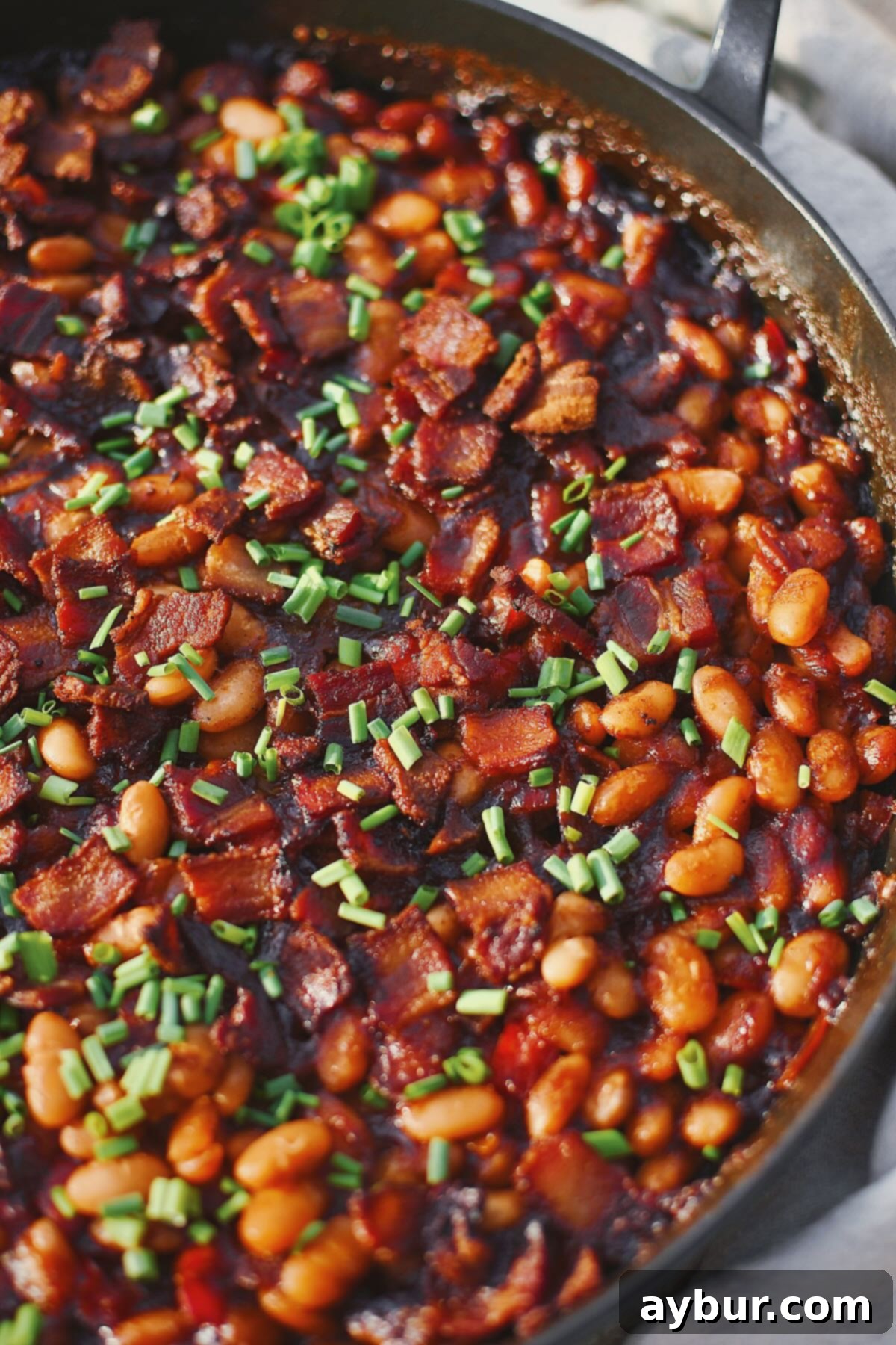 Dr. Pepper Baked Beans, just out of the oven and topped with chives.