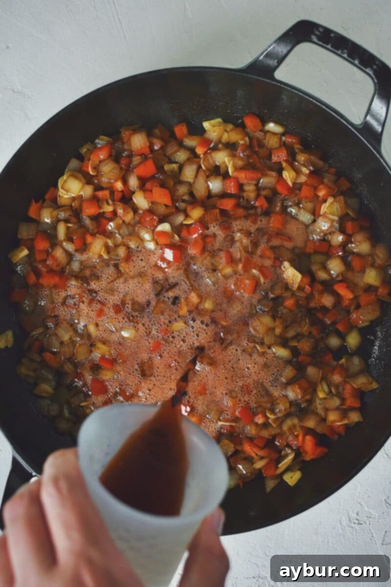 Deglazing the pan with the cherry dr. pepper after sweating the vegetables in bacon fat.