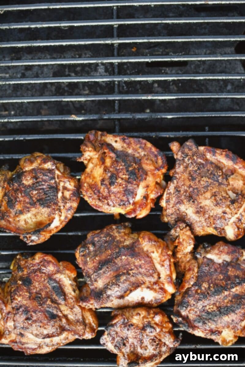 Ultimate Grilled Chicken Thighs 7 Chicken after crisping the skin, place on the off side of the grill to cook until 165ËšF internal temp with the lid closed.