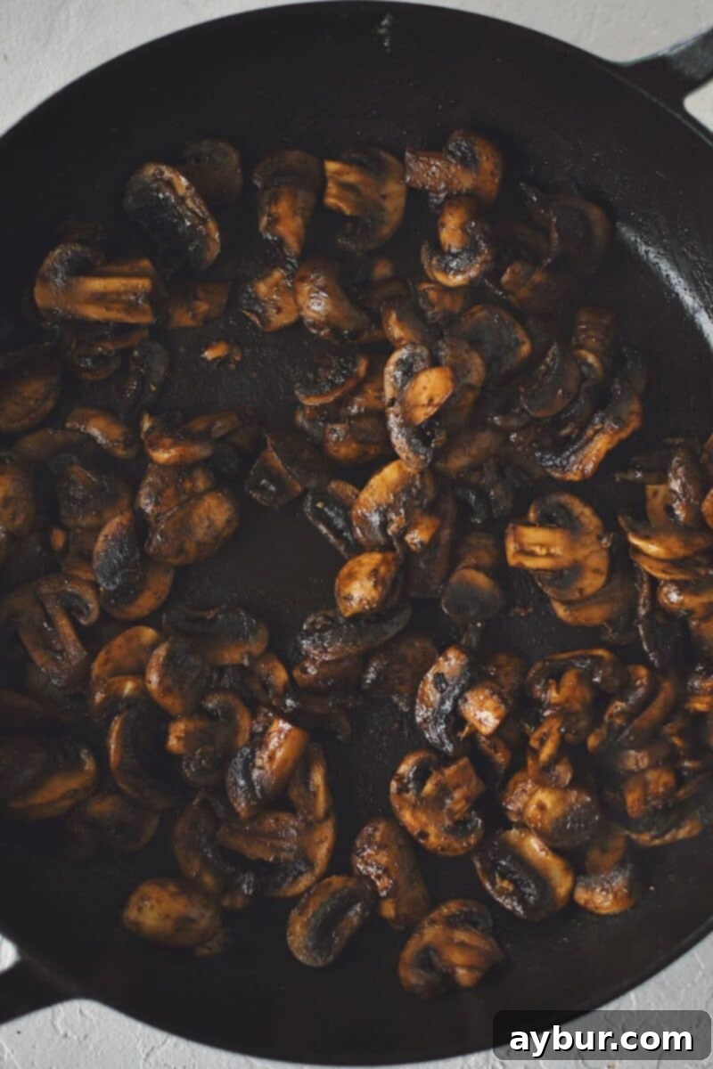 Velvety Mushroom Chicken 7 Sautéed mushrooms, beautifully golden brown and caramelized, ready for the next step of sauce preparation.