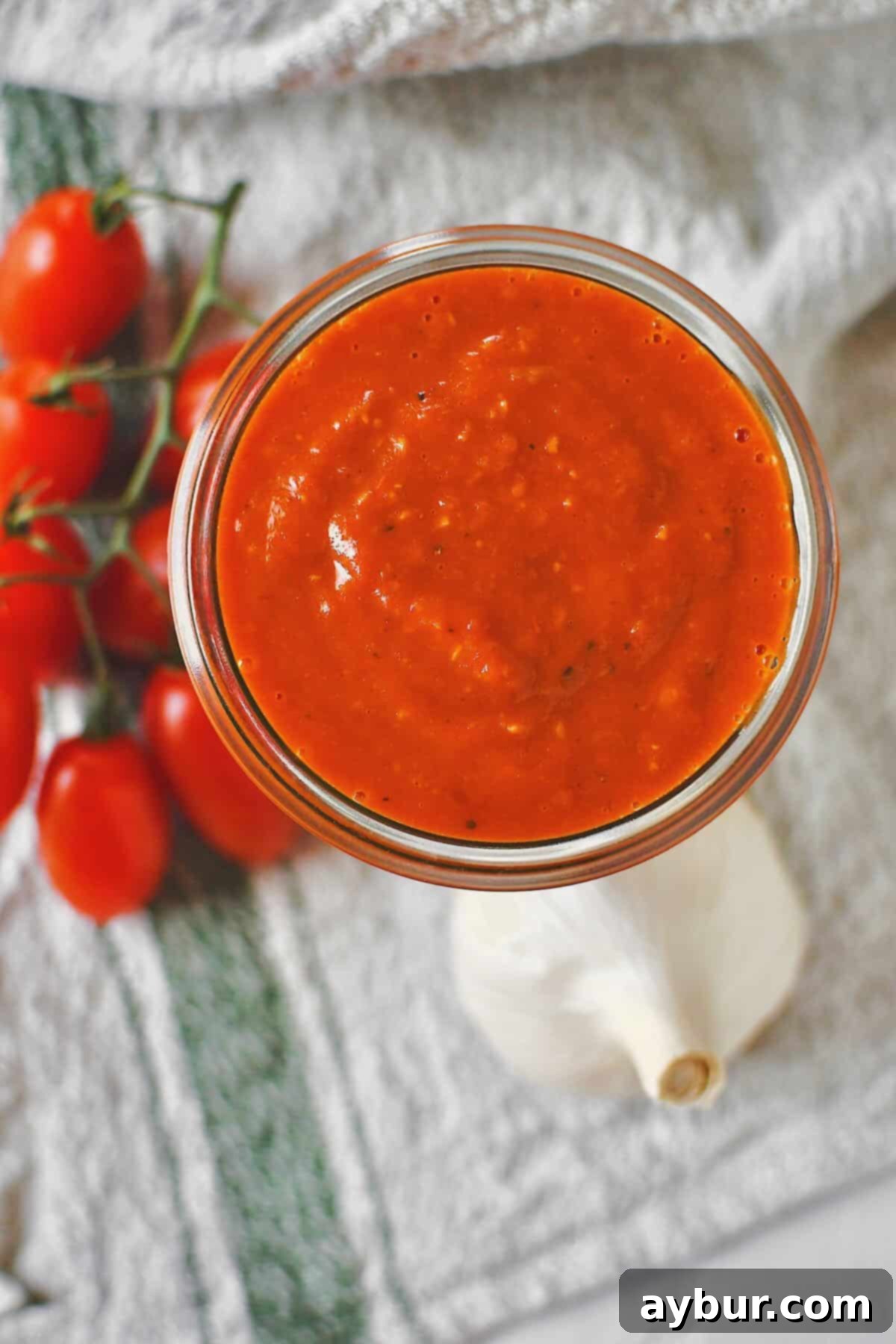 Fire-Kissed Tomato Vinaigrette 2 A jar of freshly blended Roasted Tomato Vinaigrette, showcasing its vibrant color and smooth texture, ready to be enjoyed.